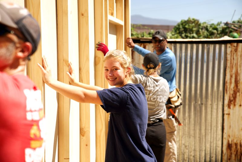 Volunteers building a home together